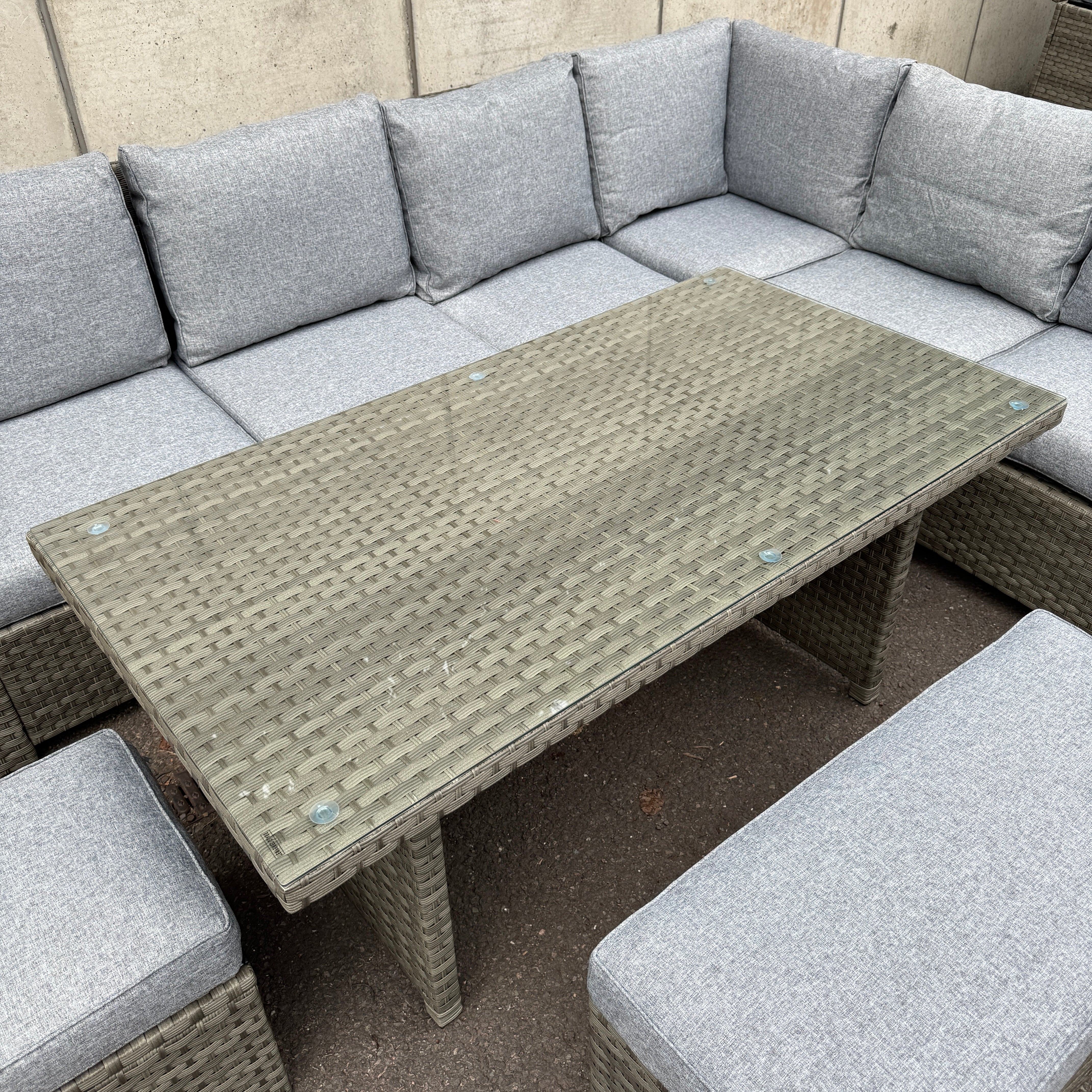 The Willow Corner Rattan Dining Set with Two Stools.